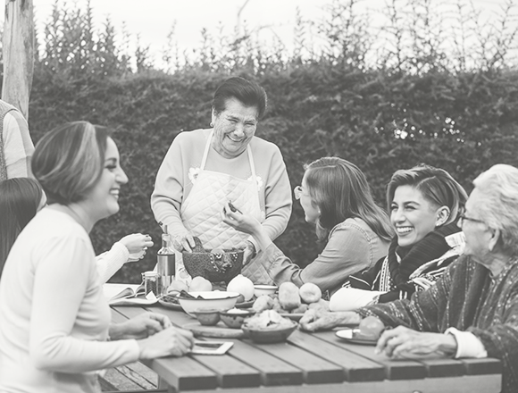 family-outside-enjoying-a-meal-all-together